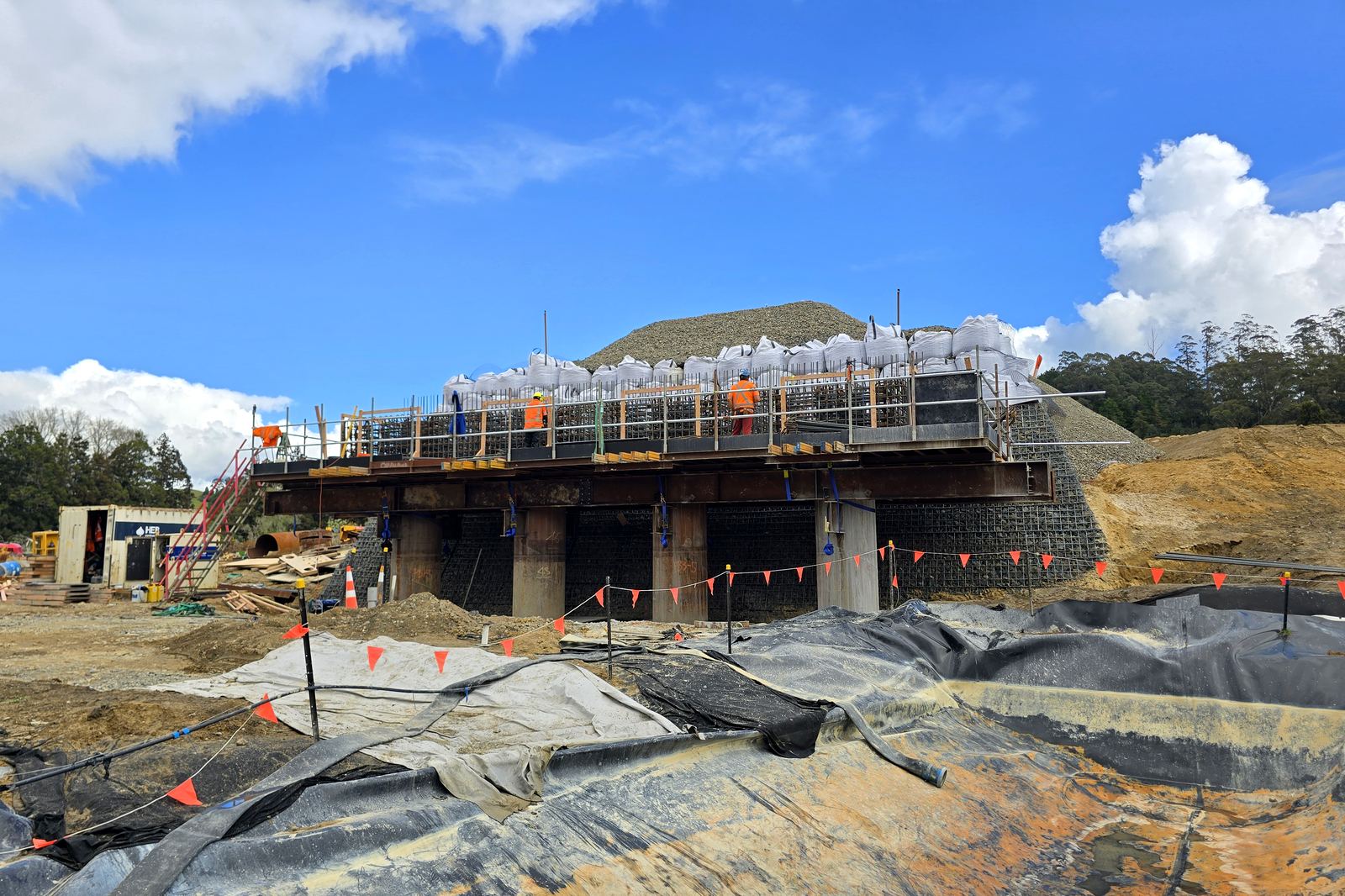 Abutment cap reinforcing ahead of the pour, with the approach fill behind. September 2026. SH29 Omanawa Bridge Replacement